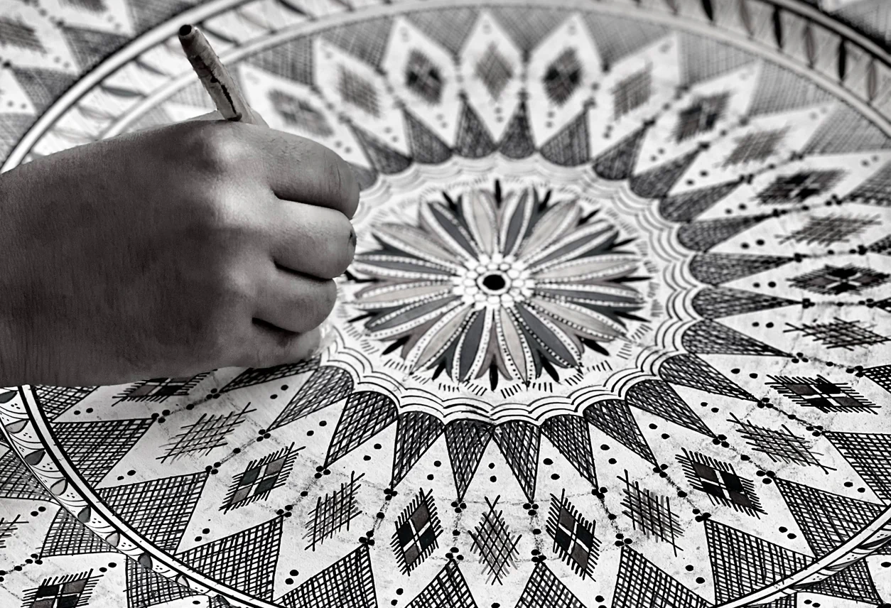 Moroccan artisan painting ceramics